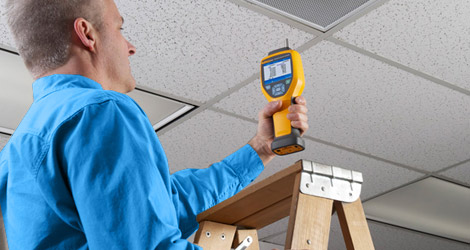 man conducting an indoor air quality VOCs test on a home in NJ